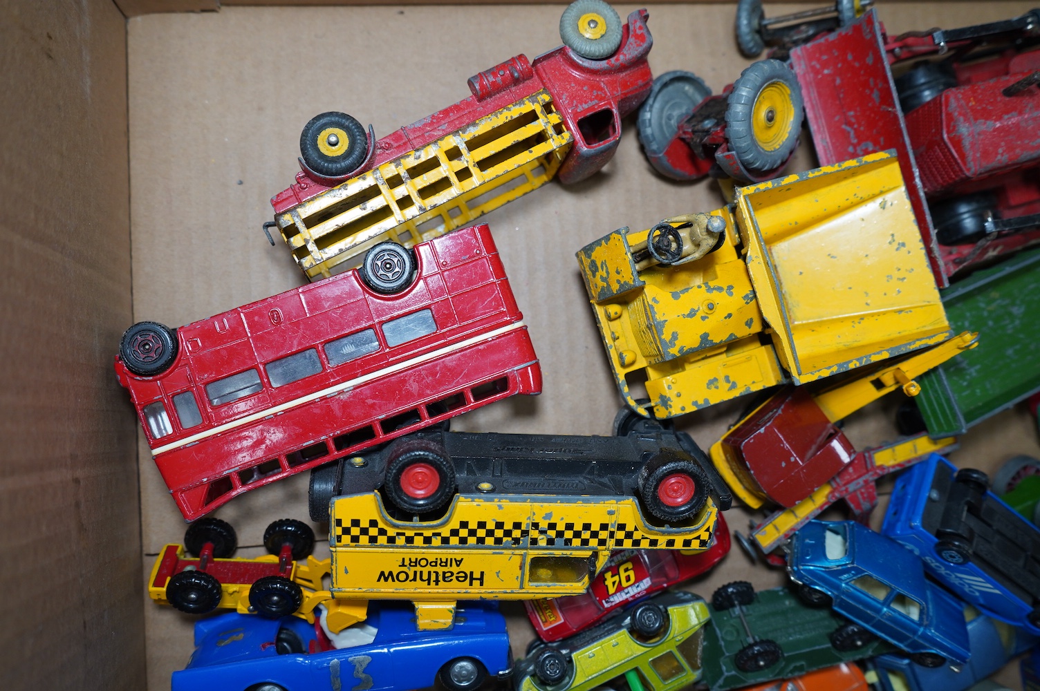 A collection of approximately ninety Dinky Toys, Corgi Toys, Matchbox Series, etc. for restoration, comprising of 1950s to 1970s diecast models of cars, commercial vehicles, military vehicles, etc. Condition - poor, most